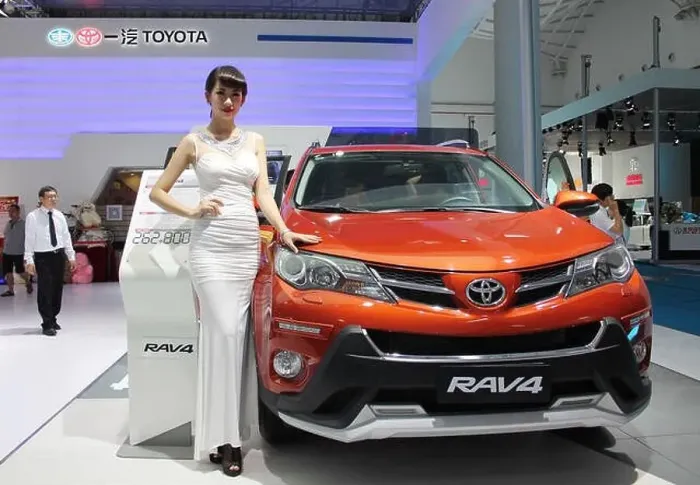 Framed Print : FILE--A Chinese model poses with a Toyota RAV4 SUV of FAW-Toyota Framed Print : FILE--A Chinese model poses with a Toyota RAV4 SUV of FAW-Toyota