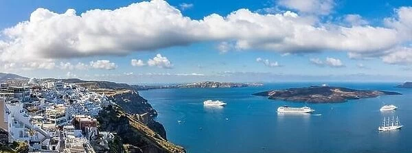 Fira town on Santorini island, Greece. Traditional and famous houses and churches with blue domes over the Caldera, Aegean sea, panorama luxury travel