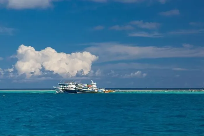 Framed Print : Fishing in the blue waters, tropical fishing boats over exotic lagoon and coral reef edge Framed Print : Fishing in the blue waters, tropical fishing boats over exotic lagoon and coral reef edge