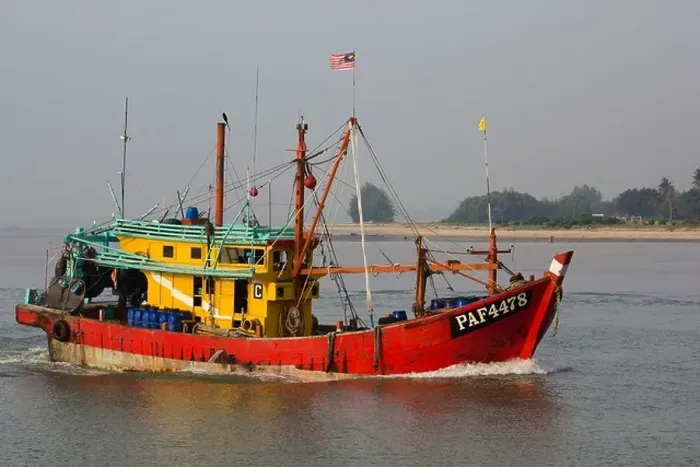 Framed Print : fishing boat entering the mouth of the Kuantan River early morning Framed Print : fishing boat entering the mouth of the Kuantan River early morning