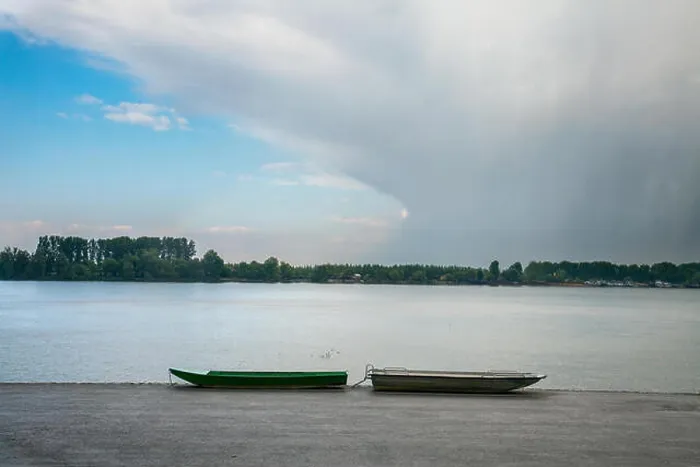 Framed Print : Two fishing boats on Zemun Quay (Zemunski kej) in a cloudy afternoon over the Danube river