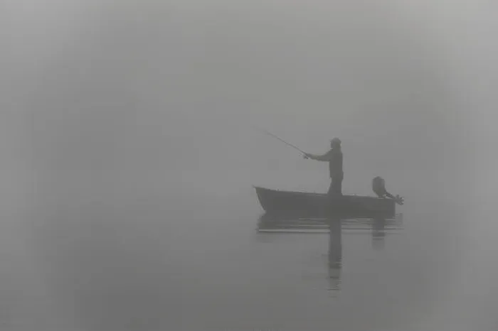 Framed Print : Fishing early morning in a row boat on a foggy lake Framed Print : Fishing early morning in a row boat on a foggy lake