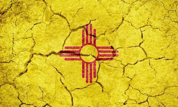 Framed Print : Flag of the U.S. state of New Mexico on dry earth ground texture background Framed Print : Flag of the U.S. state of New Mexico on dry earth ground texture background