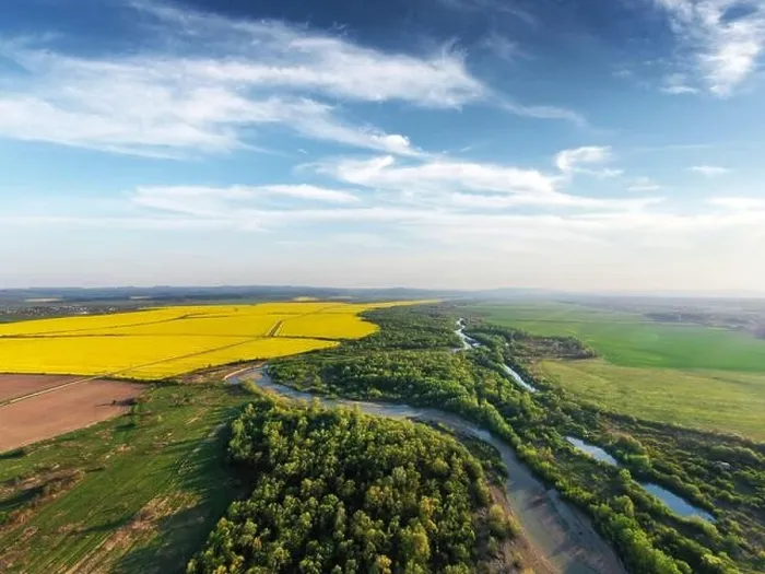 Framed Print : Flight through majestic river, lush green forest and blooming yellow rapeseed fields at sunset time. Landscape photography Framed Print : Flight through majestic river, lush green forest and blooming yellow rapeseed fields at sunset time. Landscape photography