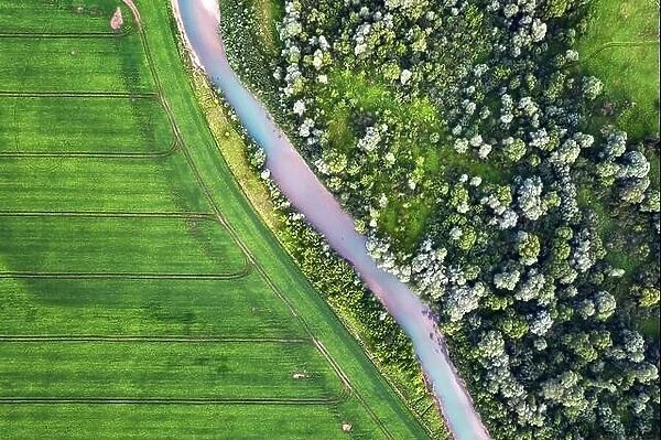 Flight through majestic Ukrainian landscape with river Dnister and green fields at sunset time. Summertime