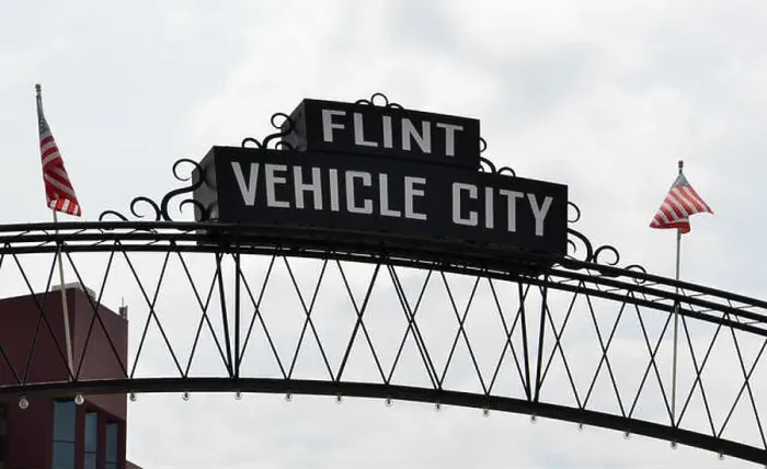 Framed Print : FLINT, MI - AUGUST 22: Flint Vehicle City sign, shown here on August 22, 2015, spans downtown Flint, MI Framed Print : FLINT, MI - AUGUST 22: Flint Vehicle City sign, shown here on August 22, 2015, spans downtown Flint, MI