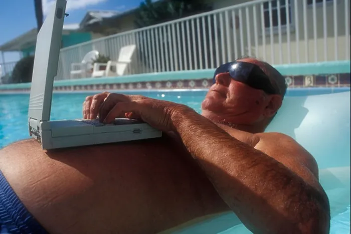 Framed Print : Floating in Pool laptop on Stomach Framed Print : Floating in Pool laptop on Stomach