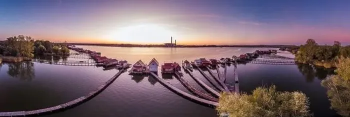 Framed Print : Floating village Bokodi to in Hungary at sunset. These houses belong to local fishermen Framed Print : Floating village Bokodi to in Hungary at sunset. These houses belong to local fishermen