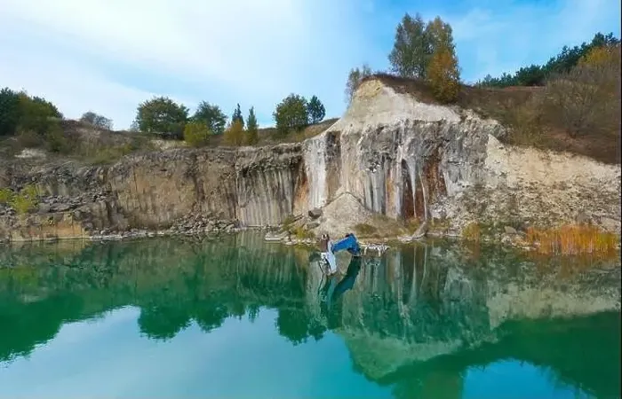 Framed Print : Flooded basalt quarry with sunken excavator.Drone view Framed Print : Flooded basalt quarry with sunken excavator.Drone view