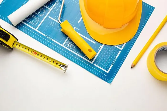 Framed Print : Floor plan, hard hat, tape measure, construction tools on a white background Framed Print : Floor plan, hard hat, tape measure, construction tools on a white background