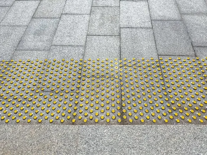 Framed Print : floor tactile indicators on sidewalk to guide vision impaired person. surface for visually impaired Framed Print : floor tactile indicators on sidewalk to guide vision impaired person. surface for visually impaired