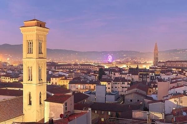Florence, Italy historic cityscape with church bell towers at dusk