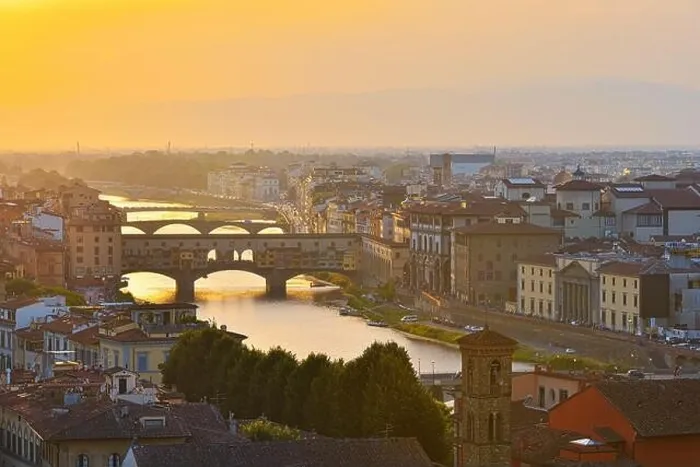 Framed Print : Florence, Italy - July 19, 2017: View of the River Arno and famous bridge Ponte Vecchio. Amazing evening golden hour light. Beautiful gold sunset in F Framed Print : Florence, Italy - July 19, 2017: View of the River Arno and famous bridge Ponte Vecchio. Amazing evening golden hour light. Beautiful gold sunset in F