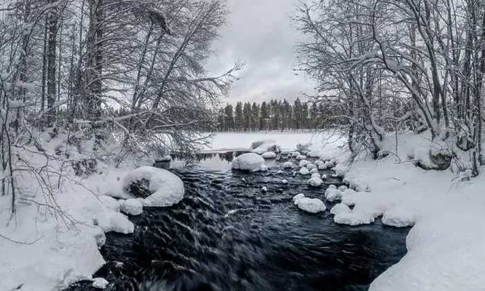 Framed Print : Flowing river in snowy winter landscape in Finland Framed Print : Flowing river in snowy winter landscape in Finland