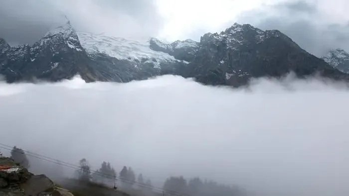 Framed Print : Fly over majestic mountain peaks and a fog. Creative. Valley covered by clouds and mountains on the background Framed Print : Fly over majestic mountain peaks and a fog. Creative. Valley covered by clouds and mountains on the background