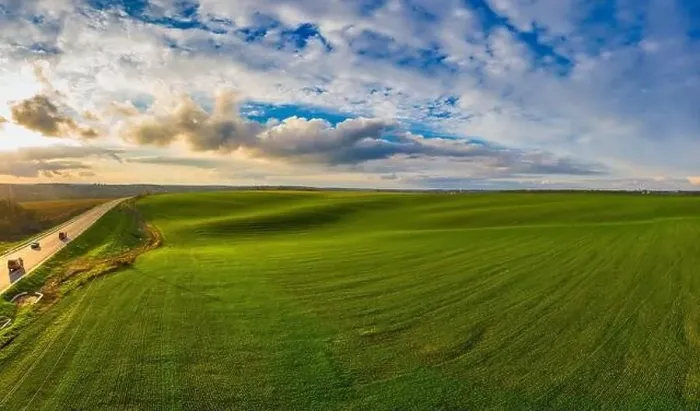 Framed Print : Flying over a field of growing wheat. Aerial panoramic drone shot Framed Print : Flying over a field of growing wheat. Aerial panoramic drone shot