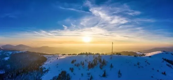 Framed Print : Flying over radio tower in mountains, snow covered winter landscape Framed Print : Flying over radio tower in mountains, snow covered winter landscape