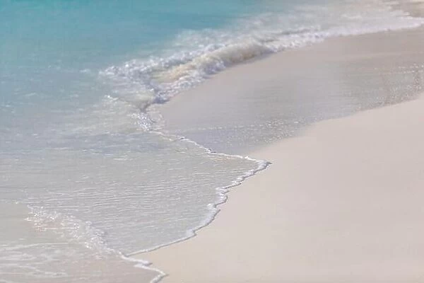 Foam wave, running on the sandy shore. Wave on sand beach, tranquil tropical nature pattern, sea ocean water on coast