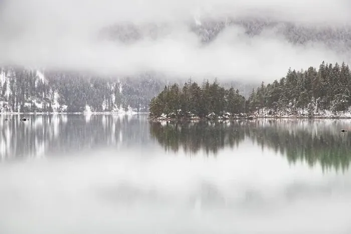 Framed Print : Foggy lake in winter snowfall Framed Print : Foggy lake in winter snowfall