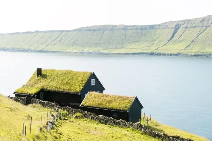 Framed Print : Foggy morning view of a house with grass roof in the Velbastadur village on Streymoy island, Faroe islands, Denmark. Landscape photography Framed Print : Foggy morning view of a house with grass roof in the Velbastadur village on Streymoy island, Faroe islands, Denmark. Landscape photography