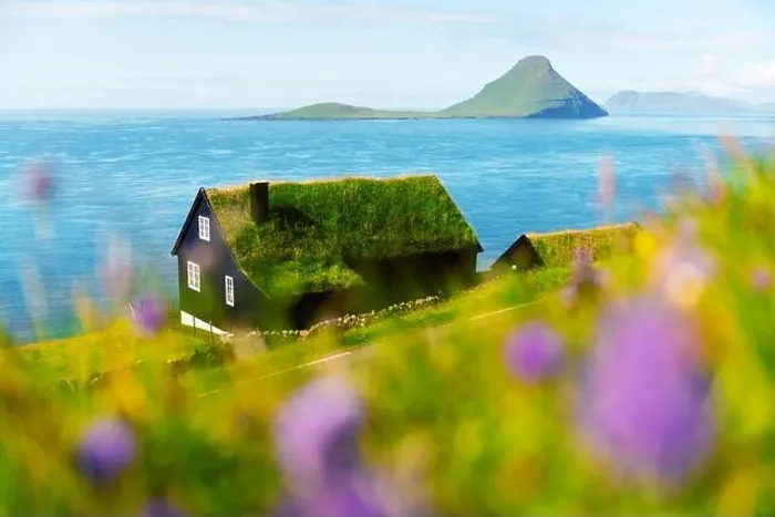 Framed Print : Foggy morning view of a house with typical turf-top grass roof in the Velbastadur village on Streymoy island, Faroe islands, Denmark Framed Print : Foggy morning view of a house with typical turf-top grass roof in the Velbastadur village on Streymoy island, Faroe islands, Denmark