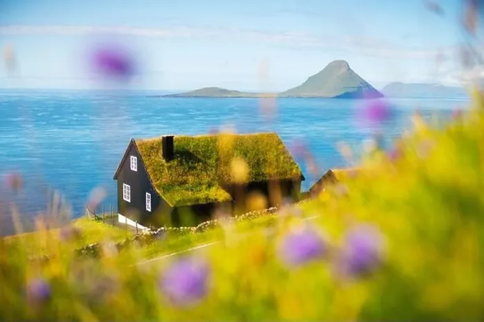 Framed Print : Foggy morning view of a house with typical turf-top grass roof in the Velbastadur village on Streymoy island, Faroe islands, Denmark Framed Print : Foggy morning view of a house with typical turf-top grass roof in the Velbastadur village on Streymoy island, Faroe islands, Denmark