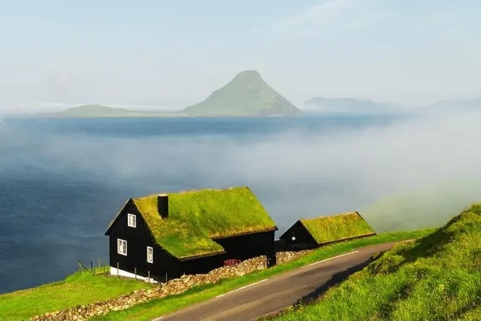 Framed Print : Foggy morning view of a house with typical turf-top grass roof in the Velbastadur village on Streymoy island, Faroe islands, Denmark. Landscape photog Framed Print : Foggy morning view of a house with typical turf-top grass roof in the Velbastadur village on Streymoy island, Faroe islands, Denmark. Landscape photog