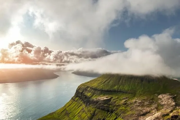 Framed Print : Foggy mountain peaks and clouds covering sea and mountains. Panoramical view from famous place - Sornfelli on Streymoy island, Faroe islands, Denmark Framed Print : Foggy mountain peaks and clouds covering sea and mountains. Panoramical view from famous place - Sornfelli on Streymoy island, Faroe islands, Denmark