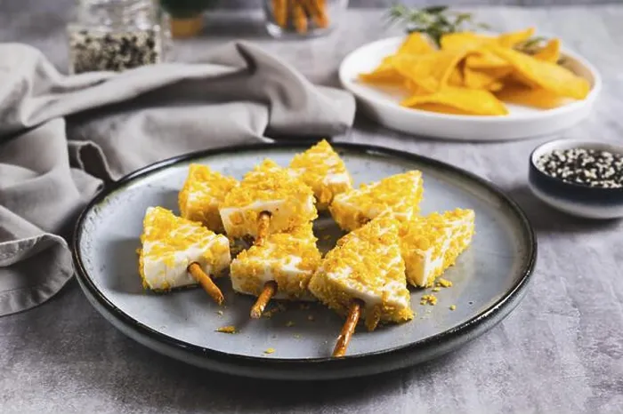 Framed Print : Food, Fake Christmas trees made from triangle cheese in nacho crumbles on a plate on a table Framed Print : Food, Fake Christmas trees made from triangle cheese in nacho crumbles on a plate on a table