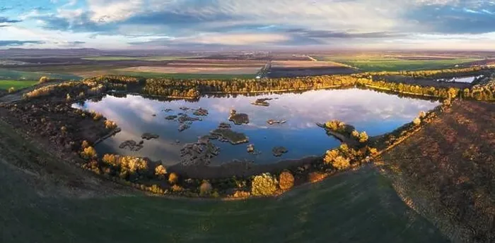 Framed Print : Forest Lake at sunset. Wild Lake in swamp, drone view. Rural landscape with lakes. Forest at bog Framed Print : Forest Lake at sunset. Wild Lake in swamp, drone view. Rural landscape with lakes. Forest at bog