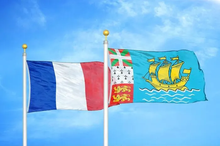 Framed Print : France and Saint Pierre and Miquelon two flags on flagpoles and blue cloudy sky Framed Print : France and Saint Pierre and Miquelon two flags on flagpoles and blue cloudy sky