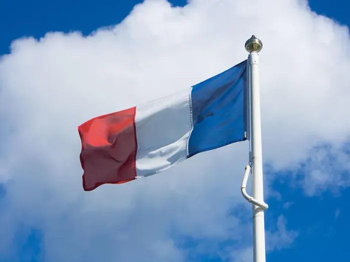 Framed Print : The French national flag flying from a flagpole Framed Print : The French national flag flying from a flagpole
