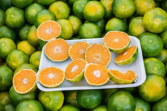 Framed Print : Freshly picked green tangerines mandarines, clementines, as Citrus fruit background Framed Print : Freshly picked green tangerines mandarines, clementines, as Citrus fruit background