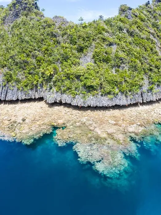 Framed Print : A fringing reef grows along a limestone island in Raja Ampat Framed Print : A fringing reef grows along a limestone island in Raja Ampat