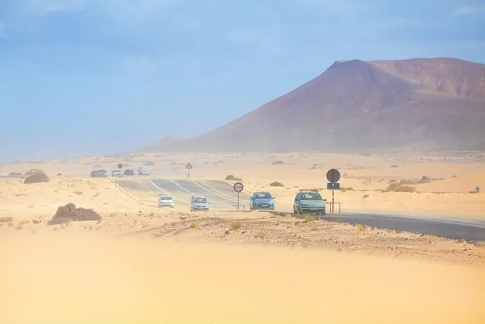 Framed Print : Fuerteventura Island, dust storm in Parque Natural de Corralejo, in the background volcano Roja, Spain, Canary Islands Framed Print : Fuerteventura Island, dust storm in Parque Natural de Corralejo, in the background volcano Roja, Spain, Canary Islands