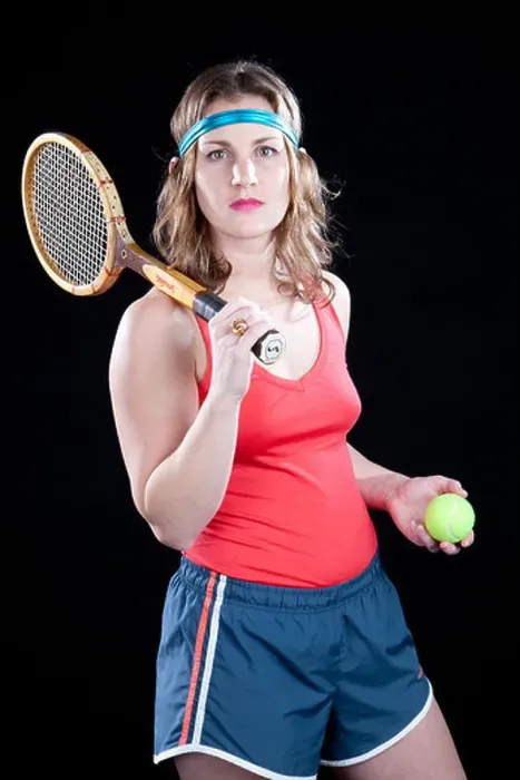 Framed Print : Funny retro female tennis player holds racket and ball, appears ready to play Framed Print : Funny retro female tennis player holds racket and ball, appears ready to play