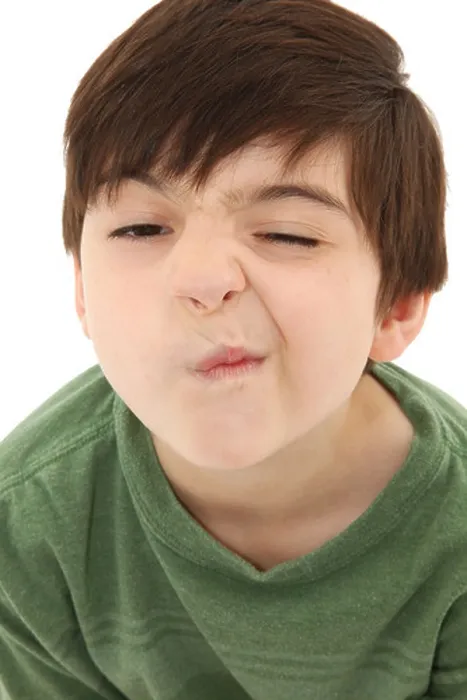 Framed Print : Funny seven year old french american boy making sneeze or nose tickle face Framed Print : Funny seven year old french american boy making sneeze or nose tickle face