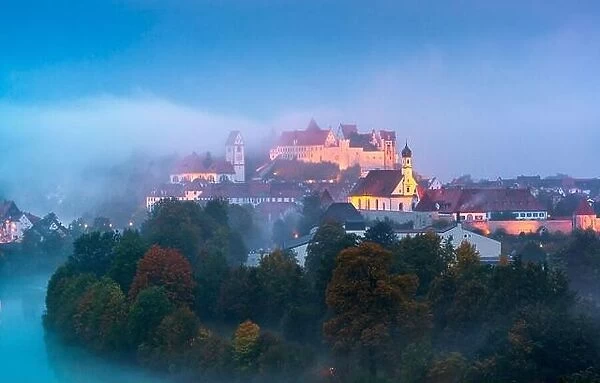 Fussen, Germany old town on the Lech River during a foggy twilight
