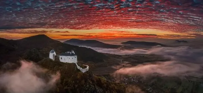 Framed Print : Fuzer, Hungary - Aerial panoramic view of the beautiful Castle of Fuzer with amazing colorful sunrise sky