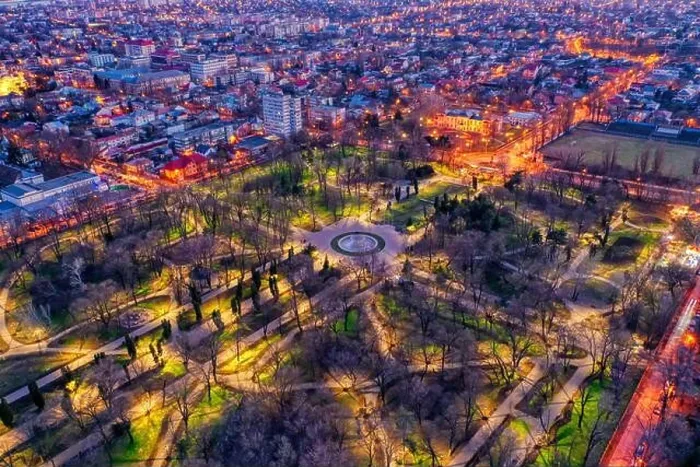 Framed Print : Galati, Romania - February 28, 2021: Aerial view of Galati City, Romania, at sunset with city lights on Framed Print : Galati, Romania - February 28, 2021: Aerial view of Galati City, Romania, at sunset with city lights on