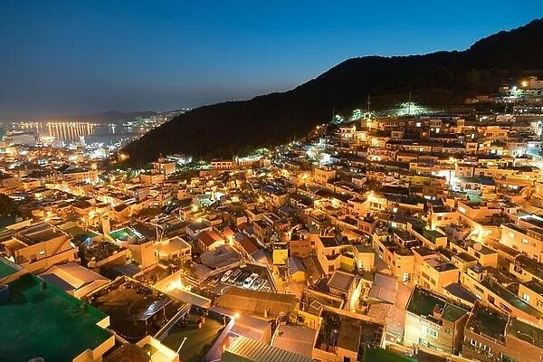 Gamcheon Culture Village formed by houses built in staircase-fashion on the foothills of a coastal mountain at night in Busan, South Korea