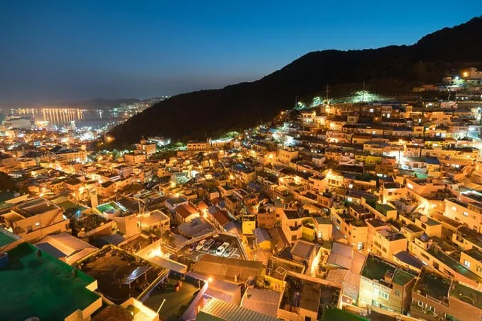 Framed Print : Gamcheon Culture Village formed by houses built in staircase-fashion on the foothills of a coastal mountain at night in Busan, South Korea Framed Print : Gamcheon Culture Village formed by houses built in staircase-fashion on the foothills of a coastal mountain at night in Busan, South Korea