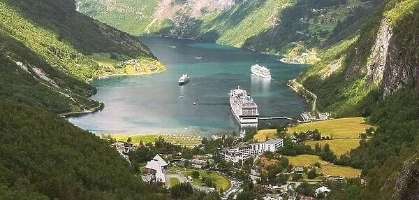 Geiranger, Geirangerfjord, Norway - June 18, 2019: Touristic Ship Ferry Boat Liner Moored Near Geiranger. Famous Norwegian Landmark And Popular Destin