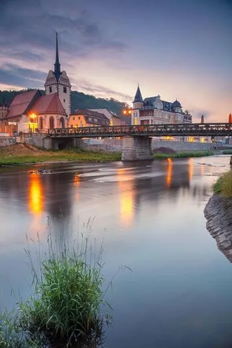 Framed Print : Gera, Germany. Cityscape image of old town Gera, Thuringia, Germany with St. Mary's Church and Untermhaus Bridge over White Elster River at sunset Framed Print : Gera, Germany. Cityscape image of old town Gera, Thuringia, Germany with St. Mary's Church and Untermhaus Bridge over White Elster River at sunset