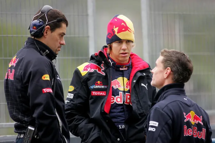 Framed Print : German Formula One driver Sebastian Vettel of Red Bull (C) talks to race engineer Guillaume Rocquelin (L) Framed Print : German Formula One driver Sebastian Vettel of Red Bull (C) talks to race engineer Guillaume Rocquelin (L)