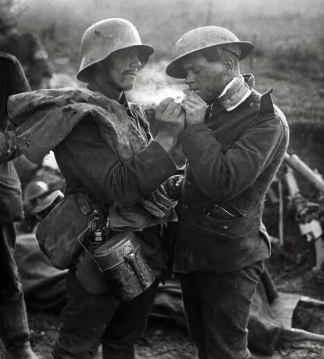 Framed Print : German soldier giving a British soldier a light during a Christmas Truce in World War One Framed Print : German soldier giving a British soldier a light during a Christmas Truce in World War One