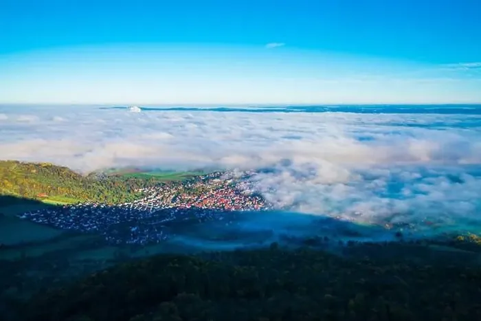 Framed Print : Germany, Bissingen an der teck village houses aerial panorama drone view above buildings under foggy ocean of clouds Framed Print : Germany, Bissingen an der teck village houses aerial panorama drone view above buildings under foggy ocean of clouds