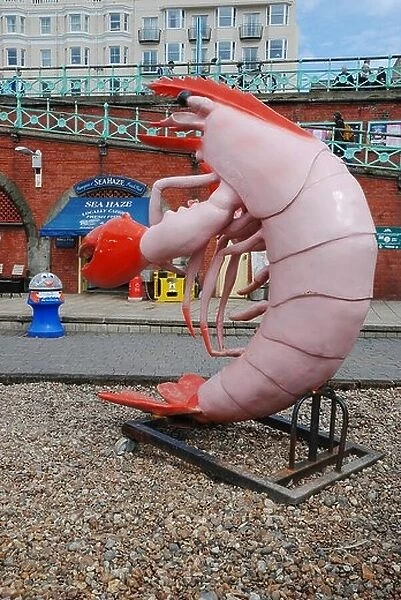 A giant plastic lobster advertising the Sea Haze fresh fish stall on the seafront at Brighton, Sussex, England