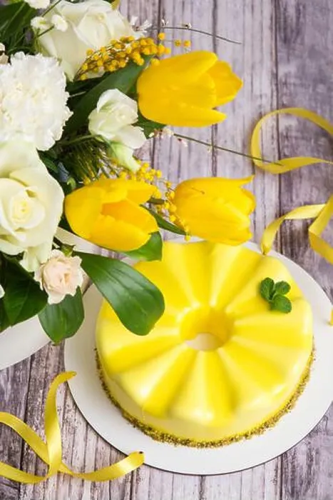 Framed Print : Gift set - yellow mousse cake and a large Spring medley bouquet of beautiful flowers. Valentine's Da Framed Print : Gift set - yellow mousse cake and a large Spring medley bouquet of beautiful flowers. Valentine's Da