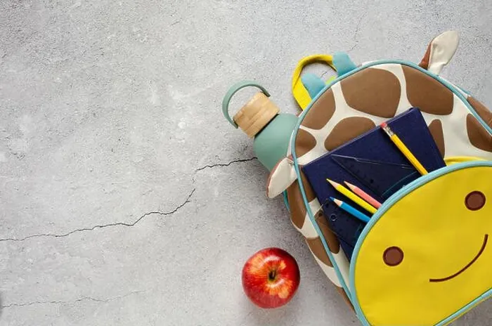 Framed Print : Giraffe backpack with school supplies, a red apple and water bottle on a concrete surface. Back to school concept Framed Print : Giraffe backpack with school supplies, a red apple and water bottle on a concrete surface. Back to school concept